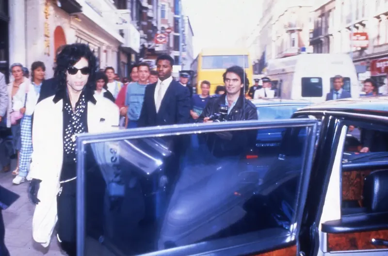 Prince on a London street with Hucky Austin on his protection detail